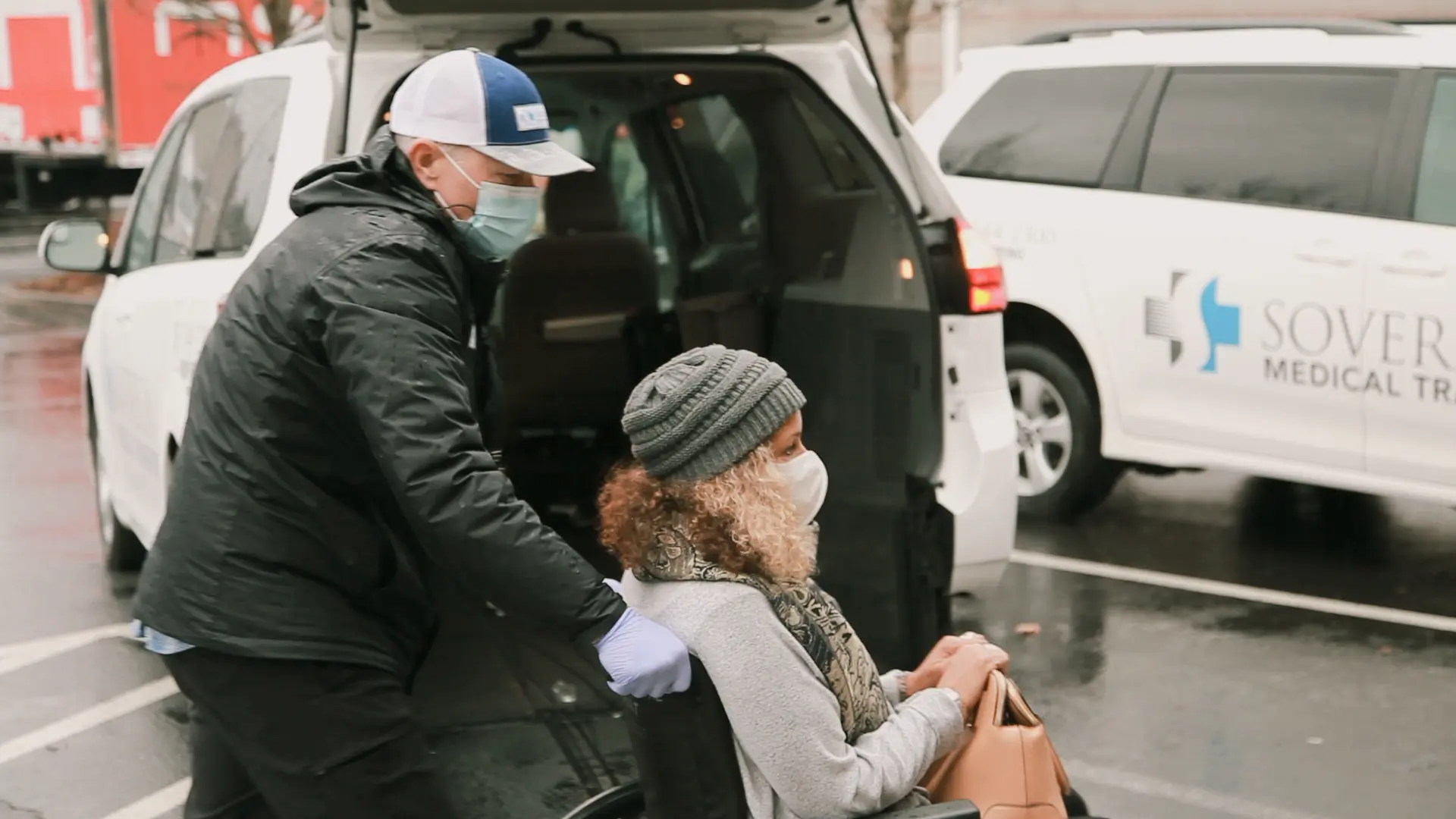 Driver assisting passenger with wheelchair